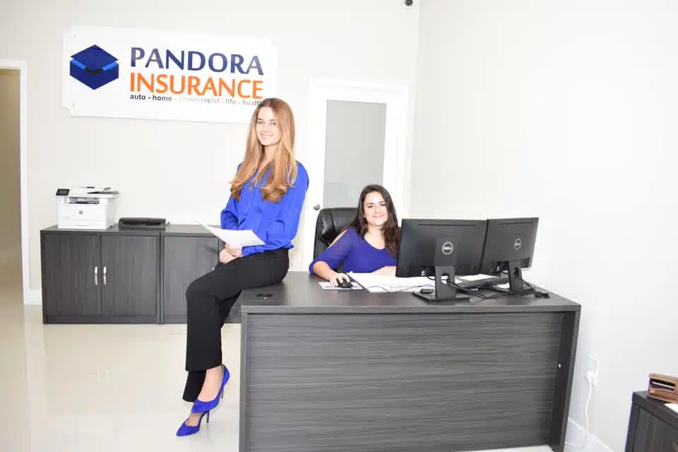 Pandora Insurance team at the front desk of founding location